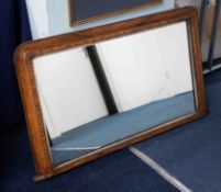 A Victorian walnut and parquetry inlaid mantel mirror, width 105cm.