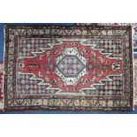 A Persian rug, length 157cm (faded).