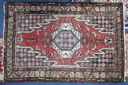 A Persian rug, length 157cm (faded).