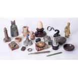 A collection of various serpentine ornaments and carvings, also a damaged Oriental green hardstone