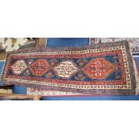 A large Persian runner, length 331cm (damaged).