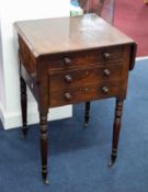 A 19th Century mahogany work table, fitted with two drawers with drop flaps, ring turned legs and