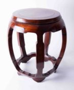 A Chinese style circular stool in hardwood, height 46cm.