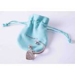 A silver Tiffany & Co heart tag keyring, weight approx. 21.7g, with Tiffany gift pouch.