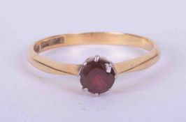 An 18ct yellow gold single stone ring set approx. 0.55 carats of garnet, weight 2.65g, size R.