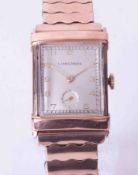 Longines, a gents mid size rectangular cased rose colour (gold filed) wristwatch, integral expanding