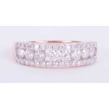 A 9ct rose gold half eternity three row ring set 1.00 carats total weight of Canadian round