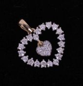 A 9ct yellow gold heart pendant set 0.50 carats of Canadian round brilliant cut diamonds, colour G-H