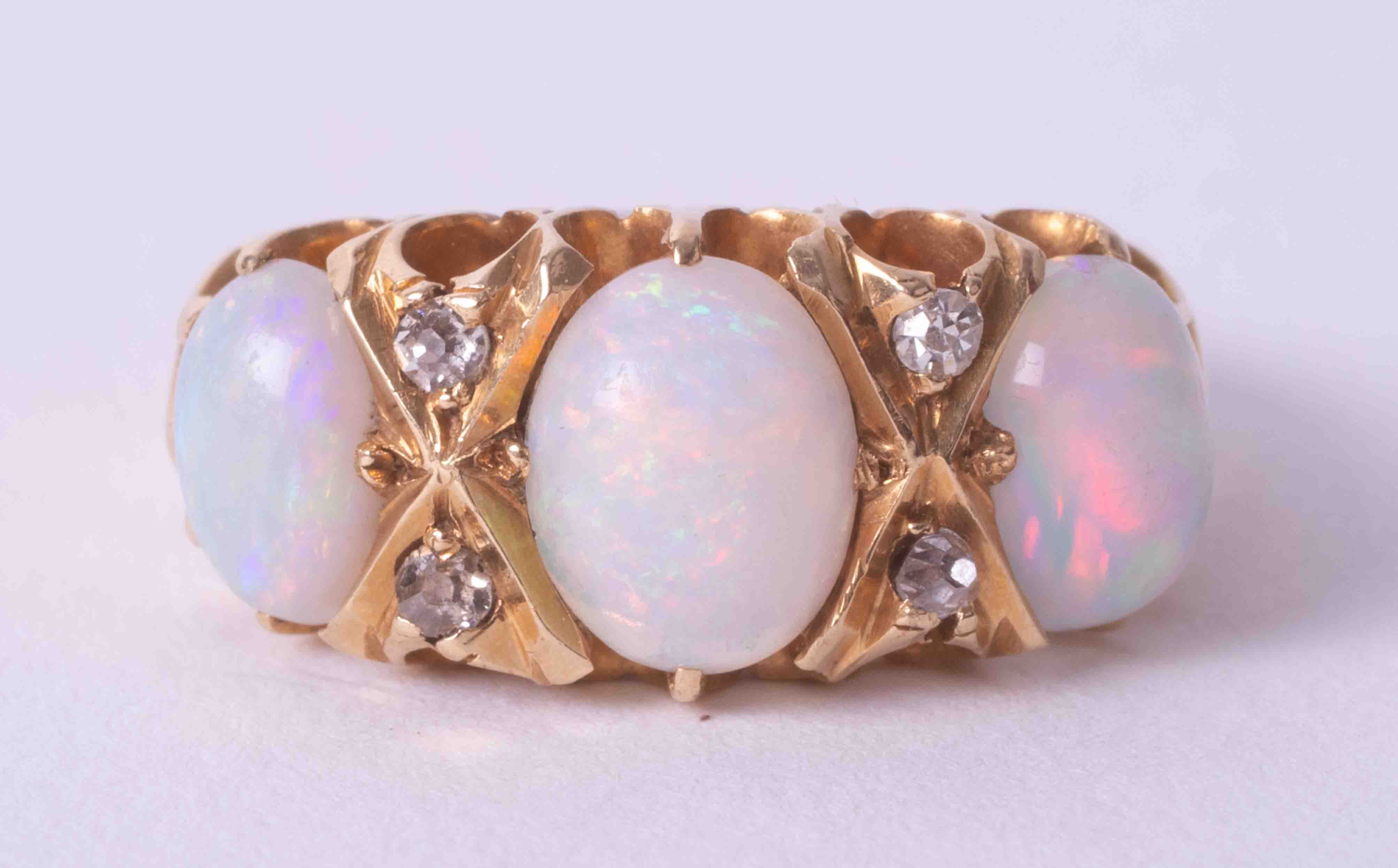 A 18ct yellow gold opal and diamond ring, size K.