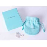 A silver Tiffany & Co "Please Return to Tiffany" heart shaped pendant with separate bracelet