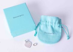 A silver Tiffany & Co "Please Return to Tiffany" heart shaped pendant with separate bracelet