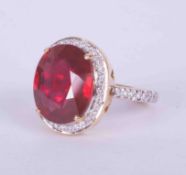 An 18ct yellow gold cocktail ring set a large ruby style stone measuring approx. 14.5mm x 12.5mm,