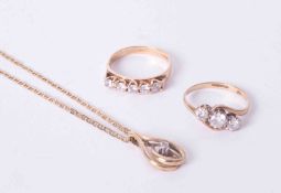 A mixed bag of two 9ct yellow gold rings set paste stones and a 9ct yellow gold chain with