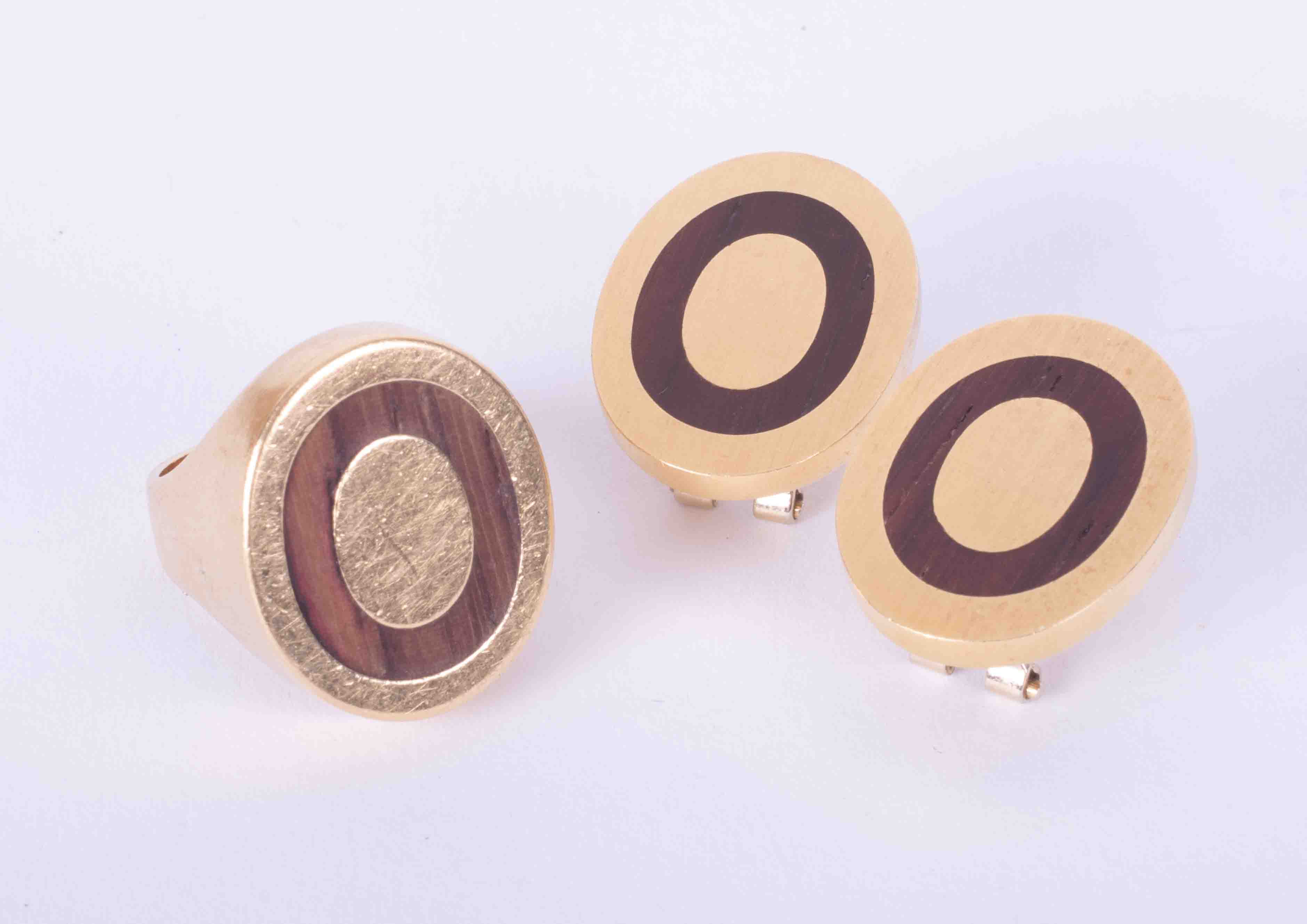 A modern set comprising a ring and earrings, gold (testing as 14ct gold but markings not