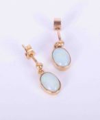 A pair of antique 9ct yellow gold drop earrings set oval white cabochon opals measuring approx. 8.