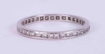 A platinum fine full eternity band set round brilliant cut diamonds, weight 2.35g, size Q.