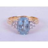 An 18ct yellow & white gold ring set an oval cut Aquamarine approx. 2.00 carats (9.5mm x 6.5mm) with