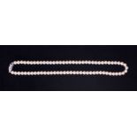 An 18" strand of vintage 6.5mm Akoya pearls with a creamy lustre and uniform in size, strung to an