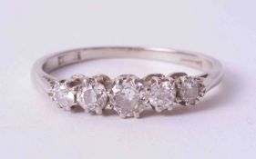 An 18ct white gold five stone ring set with approx. 0.52 carats of old cut round diamonds, colour