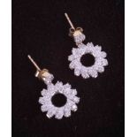 A pair of 9ct yellow & white gold flower swirl design drop earrings set 0.75 carats (total weight)