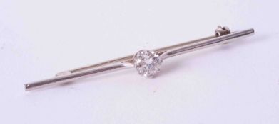 A platinum bar brooch set with a single round brilliant cut diamond of approx. 0.66 carats, colour