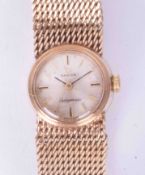 Omega, a 9ct yellow gold ladies 'Ladymatic' wristwatch, silver baton dial, circa 1969/72. Dial