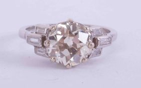 A fine platinum Art Deco ring set central round old cut diamond, approx. 2.43 carats, colour K-L &