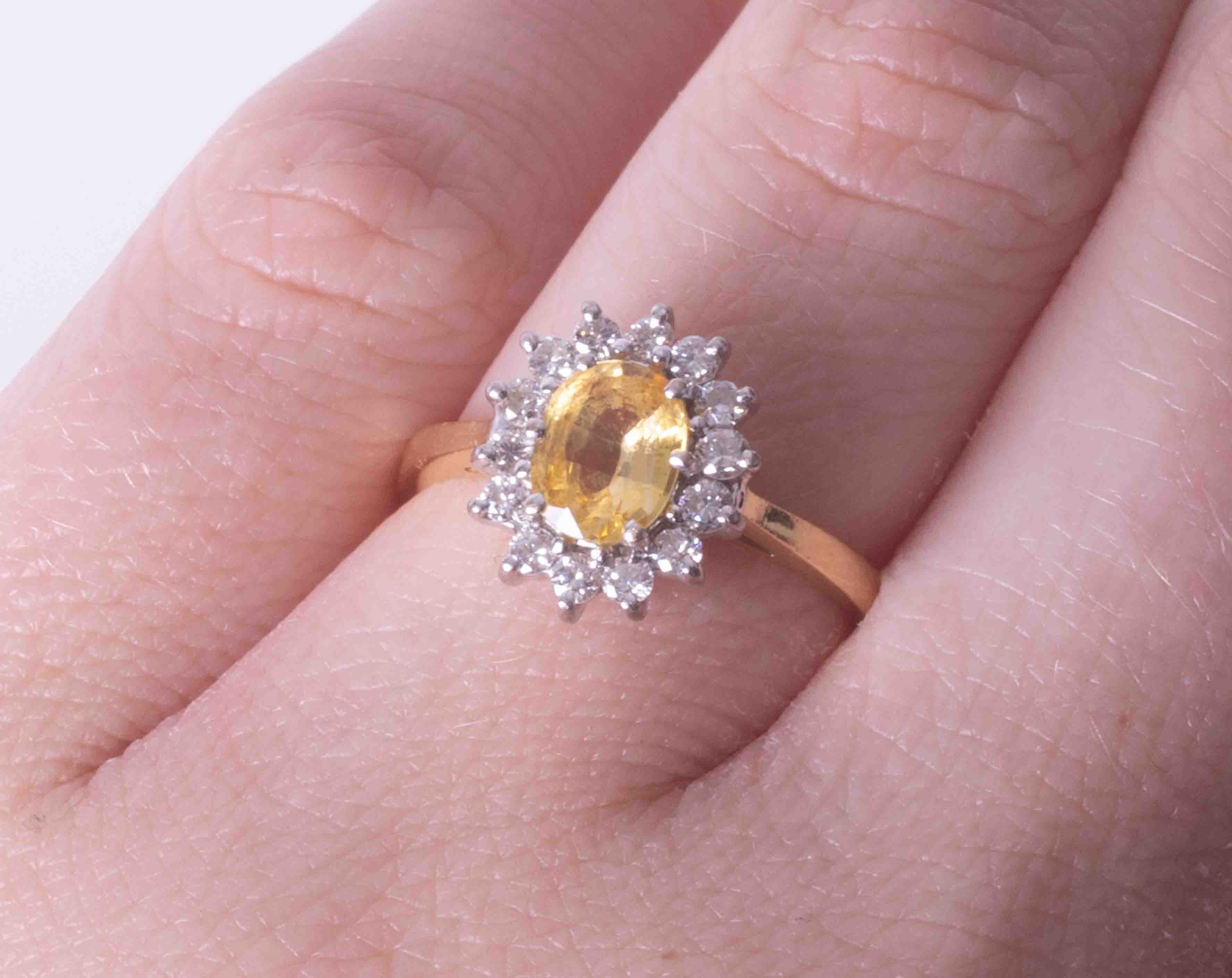 An 18ct yellow & white gold cluster ring set approx. 0.85 carat oval yellow sapphire surrounded by - Image 2 of 2