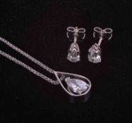 A contemporary suite comprising of a pair of 18ct white gold earrings set approx. 1.30 carats of