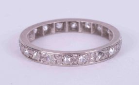 A platinum (no hallmarks & not tested) full eternity ring set with old cut diamonds in a milgrain