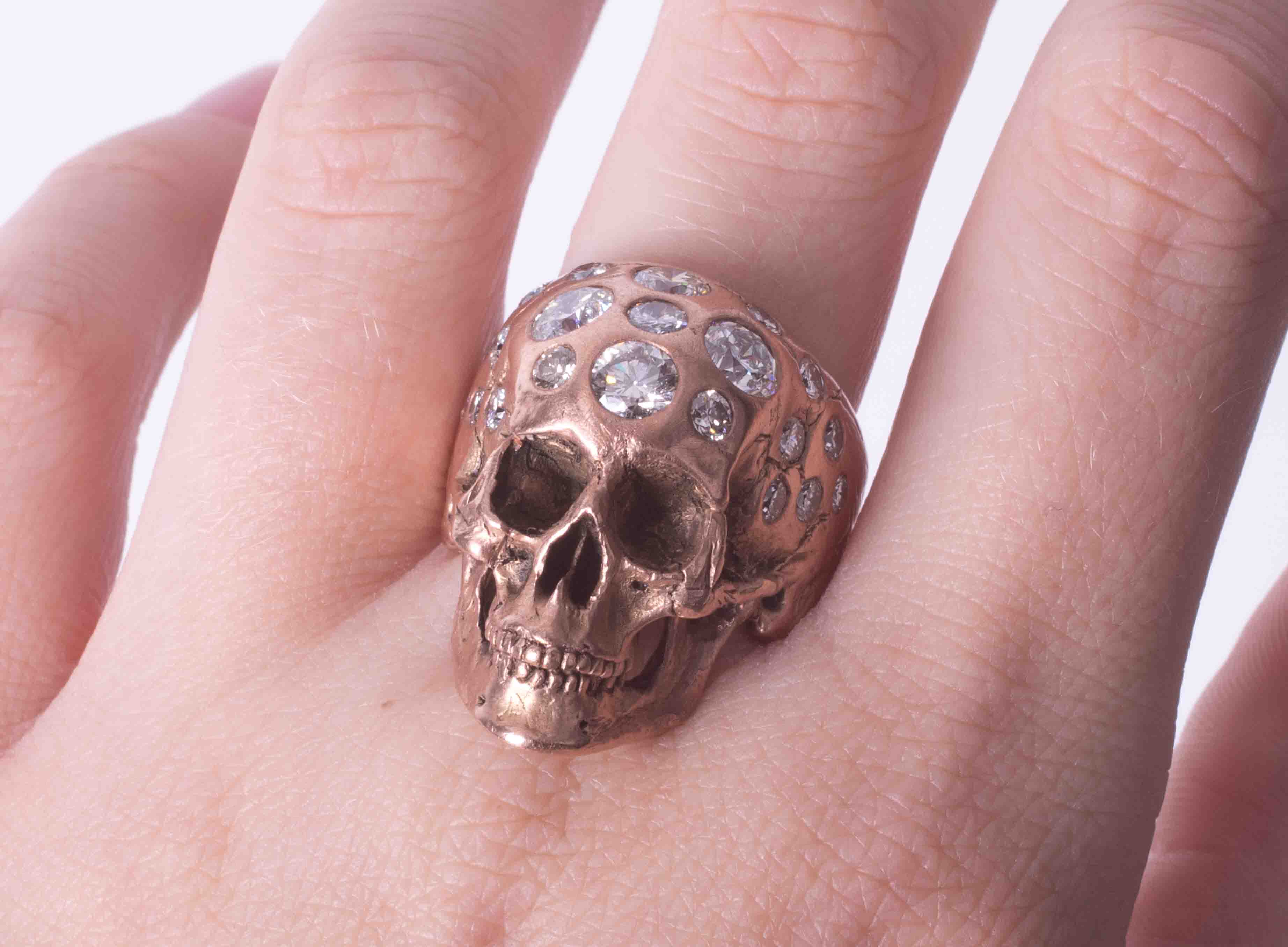 A 9ct rose gold? (not tested) skull design ring set with approx. 2.85 carats of round brilliant - Image 2 of 2
