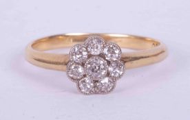 An antique 18ct yellow gold flower cluster ring set approx. 0.15 carats total weight of round cut