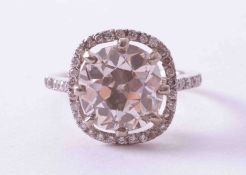 An impressive platinum ring (not hallmarked) set with a central old european cut diamond,