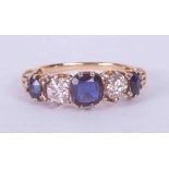 An antique 18ct yellow gold ornate five stone ring set approx. 0.80 carats total weight of oval