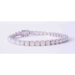 A fine 18ct white gold tennis bracelet set 37 round brilliant cut diamonds, approx. 11.60 carats,