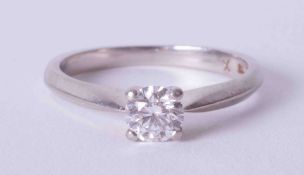 A four claw platinum solitaire ring set approx 0.45 carat round brilliant cut diamond, colour D-E