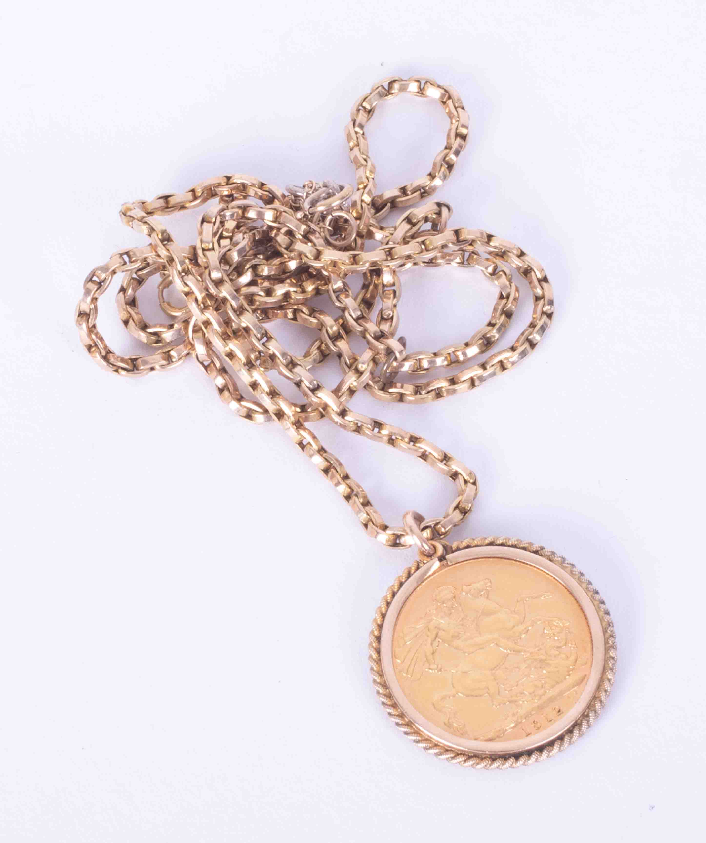 A 9ct yellow gold chain with a pendant mounted 1912 George V full sovereign, weight 20g.