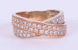 An 18ct yellow & rose gold (not tested) crossover double row ring set with small round brilliant cut