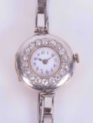 A vintage ladies 18ct gold and diamond set cocktail watch, boxed.