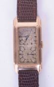 A 9ct yellow gold cased rectangular Doctors Duo Dial wristwatch. Classic Arabic top & large