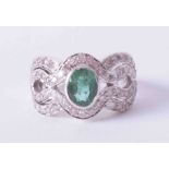 An 18ct white gold Art Deco style ring set with central oval cut emerald approx. 1.25 carats (