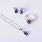 An 18k white gold jewellery suite comprising a pair of 18k white gold earrings set approx. 1.05