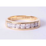 An 18ct yellow gold channel set half eternity ring set 0.50 carats of round brilliant cut