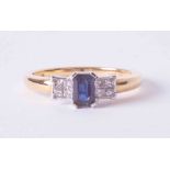 An 18ct yellow & white gold ring set approx. 0.50 carat emerald cut sapphire & 0.21ct total weight