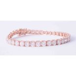 An impressive 18ct rose gold (stamped 18k) tennis bracelet set 39 round brilliant cut diamonds,