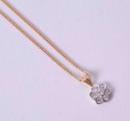 An 18ct yellow & white gold flower pendant set approx. 0.20 carats (total weight) of round brilliant