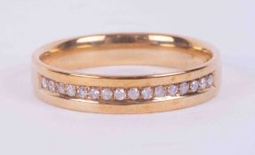 A 9ct yellow gold half eternity style ring set with 0.10 carats (total weight) of round brilliant