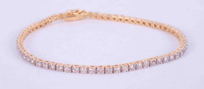 A fine 18ct yellow gold diamond line bracelet set 67 round brilliant cut diamonds, total weight