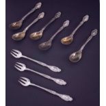 A set of six sterling silver Tiffany & Co teaspoons with scallop design, gilded bowls each