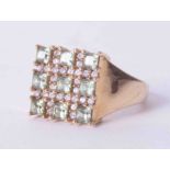 A 9ct square dress ring set with 9 stones, 5.6g.